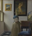 Junge Frau die an einem Virginal Barock Johannes Vermeer